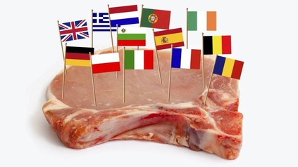 Schweinskotelett mit Fähnchen verschiedener Länder drauf